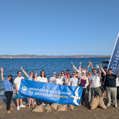 beach cleanup with AKL team photo on the beach