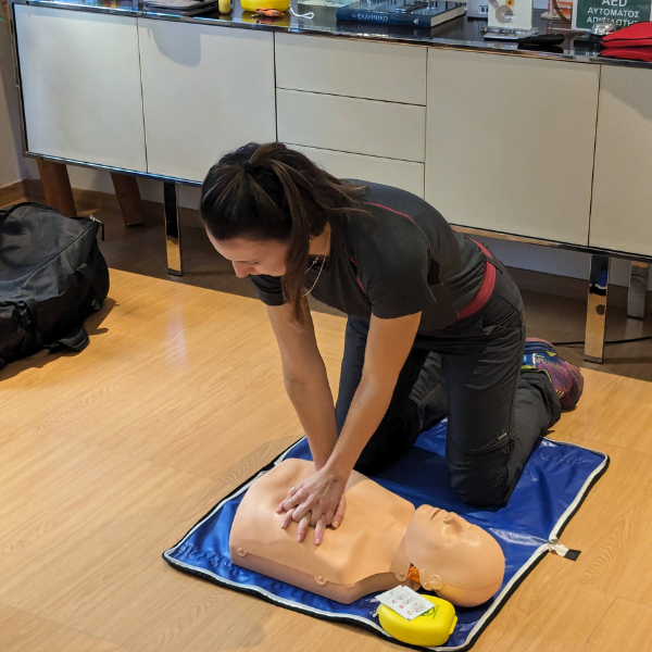 woman giving CPR to dummy